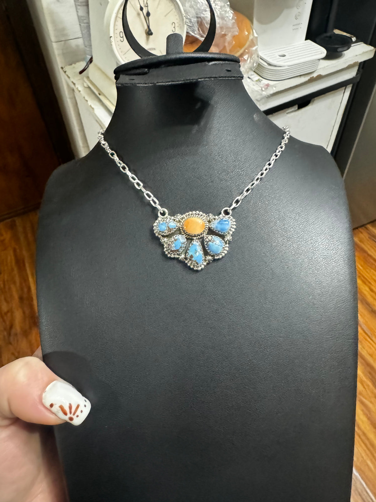 Orange spiny and gold hulls turquoise half cluster necklace