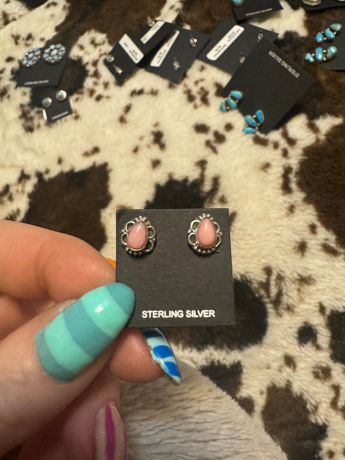 Pink conch teardrop studs