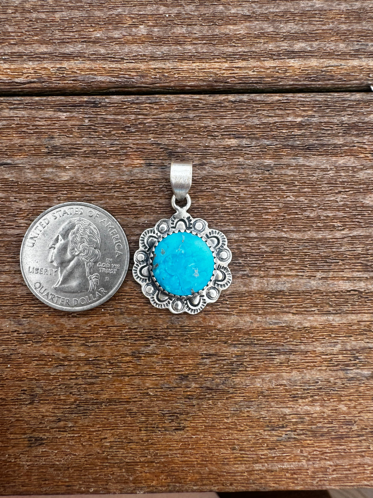 Morenci turquoise pendant with silverwork