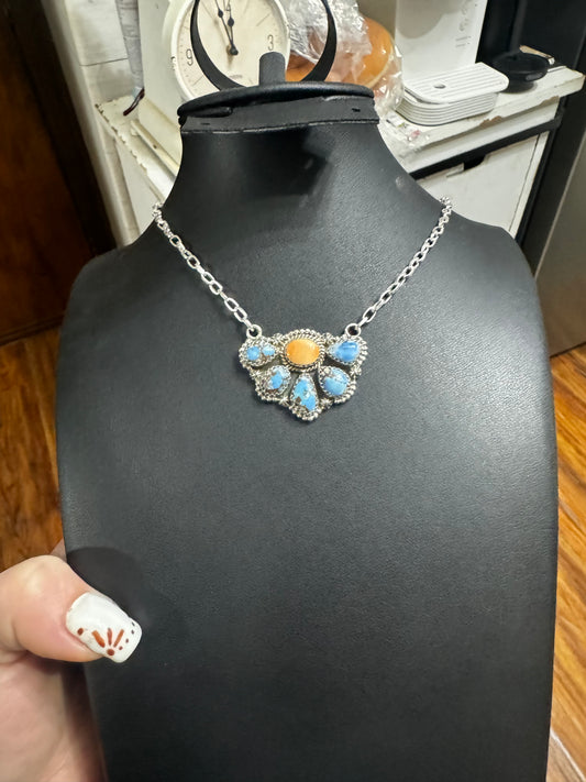 Orange spiny and gold hulls turquoise half cluster necklace