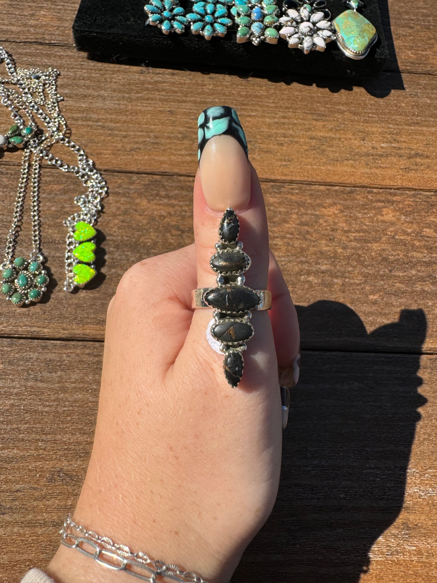 Black stallion dahlia 5 stone crawler ring