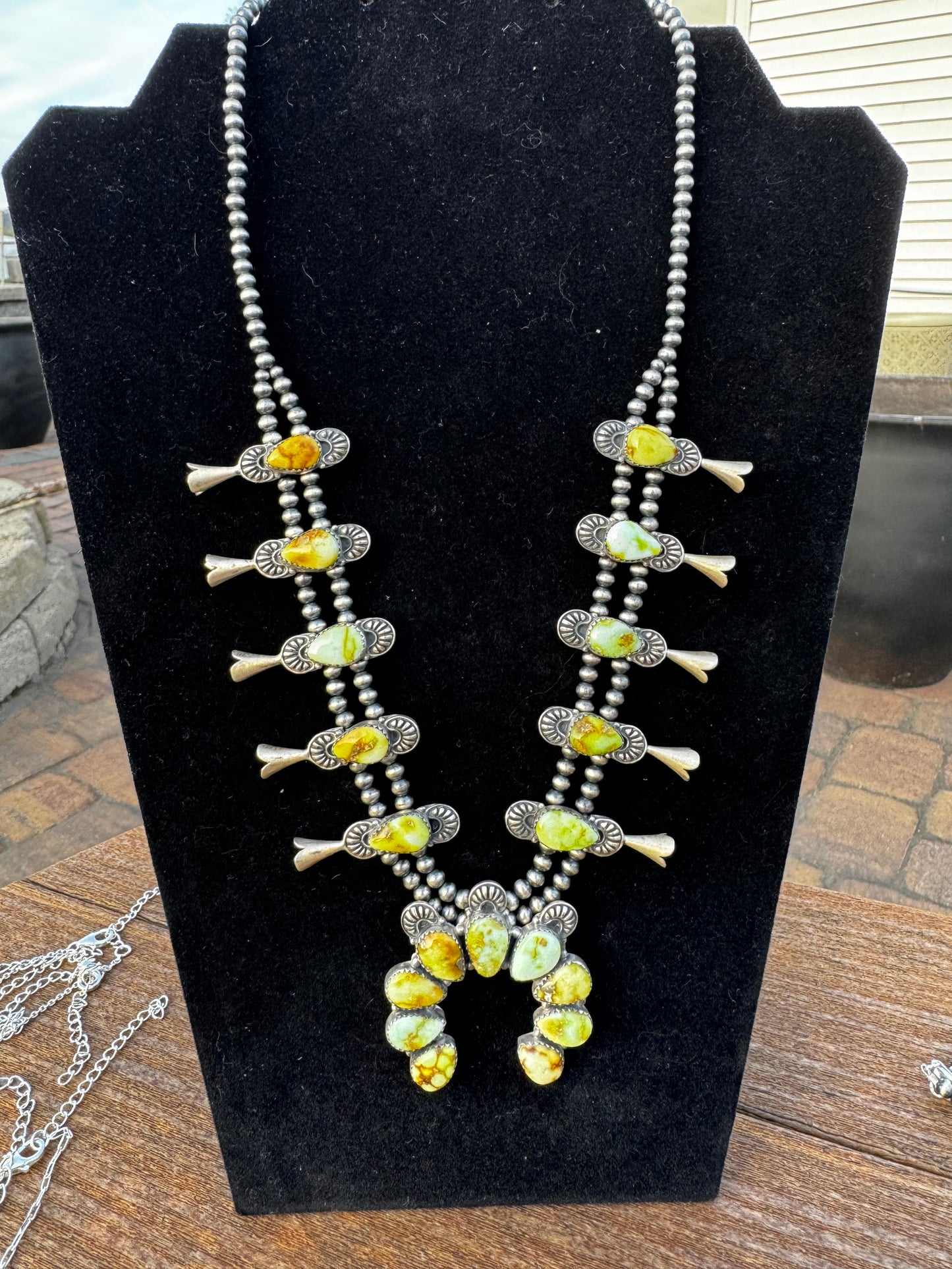 Palomino turquoise squash blossom