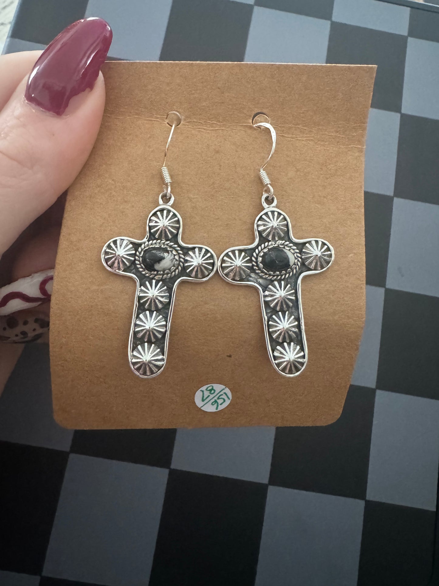 White Buffalo cross dangles with conches