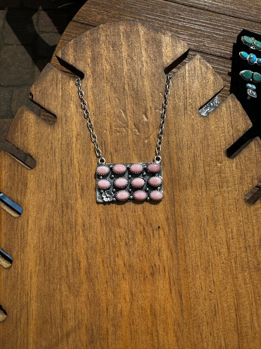 Pink conch bar necklace with silver detailing