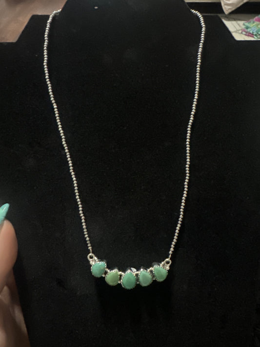Turquoise bar necklace on dainty pearls