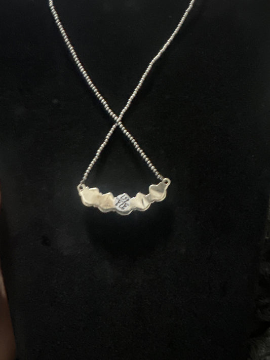 Turquoise bar necklace on dainty pearls