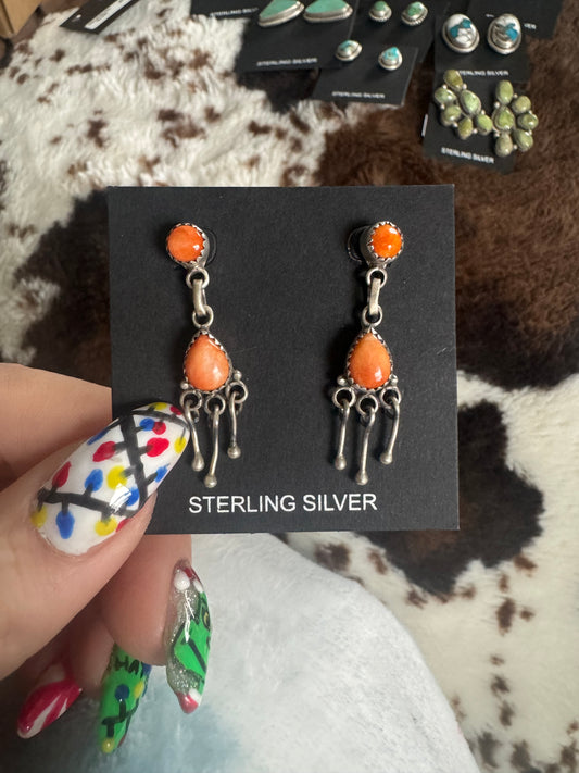 Orange spiny dangle earrings