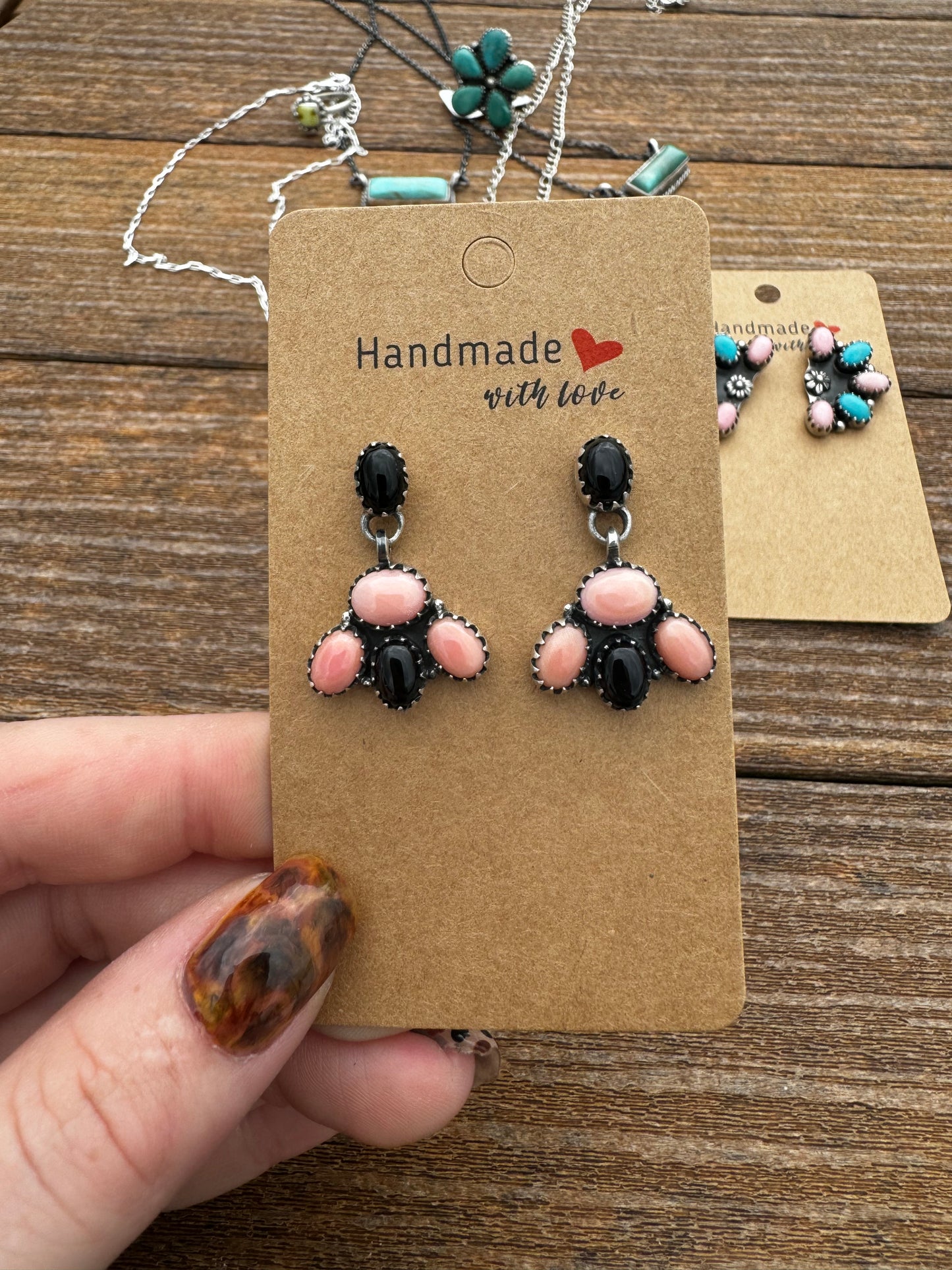 Pink conch and black onyx cluster drop earrings